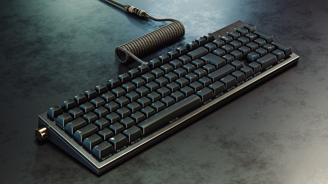 黑色紧凑型机械键盘带金色旋钮