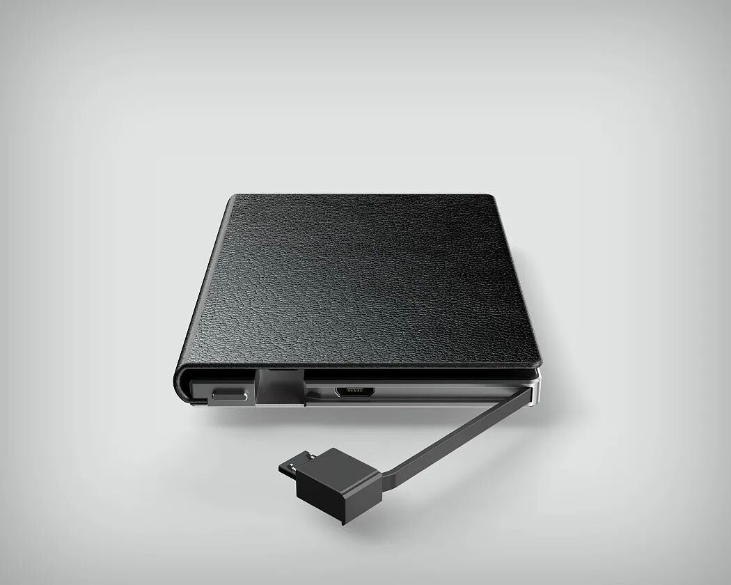 一个黑色皮革纹理的便携式电子设备，侧面带有USB接口和Micro USB接口