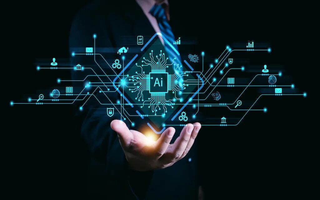 一名穿着西装的男子伸出右手,掌心向上,手中悬浮着一个发光的蓝色全息界面