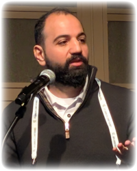 演讲者 Qais Yousef 在 Linux Plumbers Conference 2025 上介绍 QoS 提案