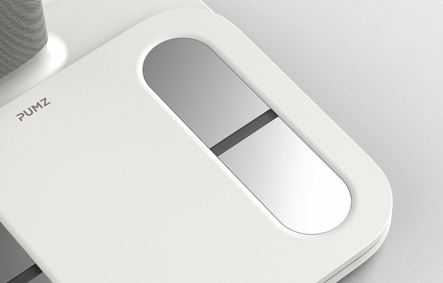白色电子秤表面特写，展示椭圆形金属区域与PUMZ标识