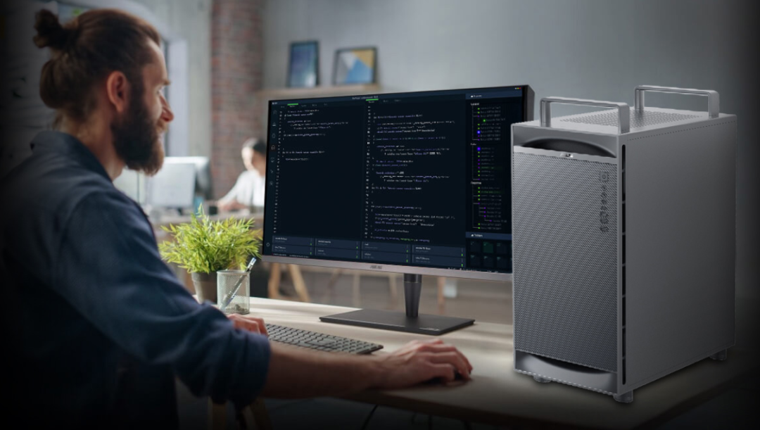 一名开发者在现代办公室中使用华硕ExpertCenter工作站进行编程