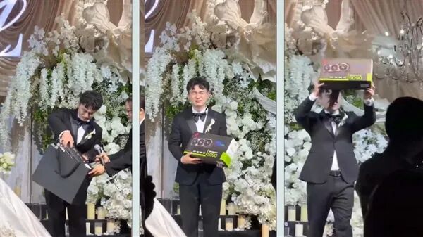 婚礼现场新郎举起RTX 5090显卡包装盒