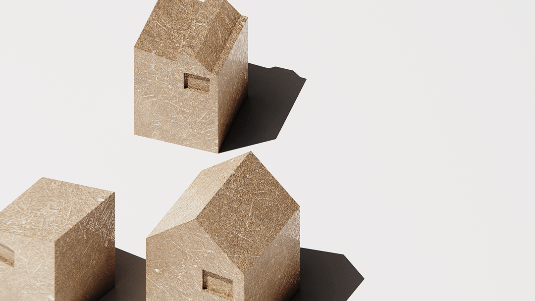 三座金色纹理的微型几何房屋模型