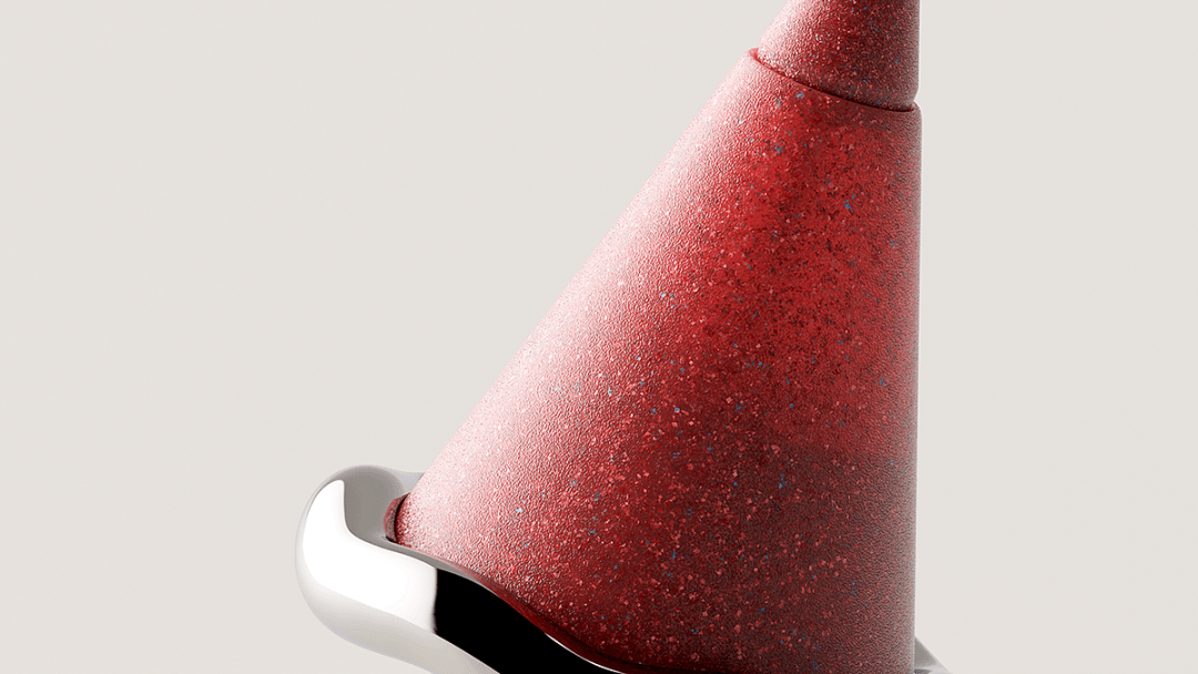 红色渐变锥形物体与银色金属底座