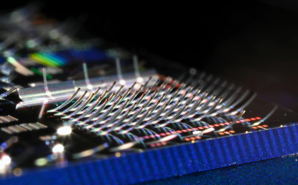 电子电路板的局部特写，展示密集的柔性金属引脚和高精度制造细节