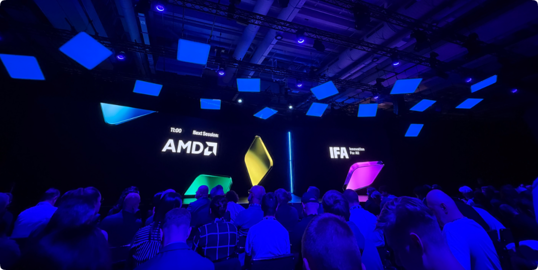 AMD IFA 2026 开幕演讲现场,屏幕上显示 AMD 与 IFA 标志及 Next Session 提示