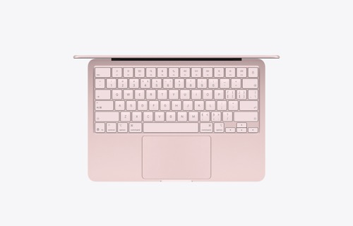 玫瑰金色笔记本电脑的俯视图