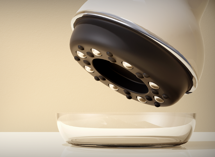 设备底部特写，展示黑色圆形结构及金属按摩触点