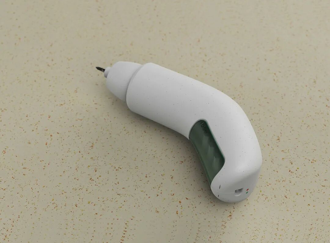 一个白色的电动螺丝刀放置在米色带斑点的台面上