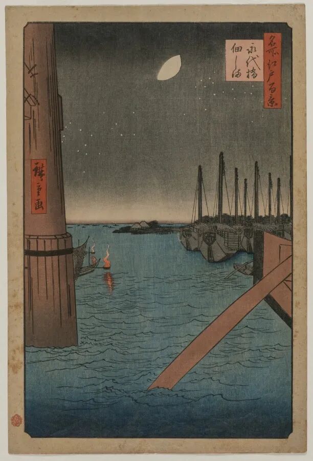 夜色水面上有桥梁、船只与远处桅杆
