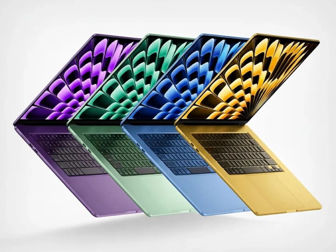 四台彩色笔记本电脑扇形排列的渲染图