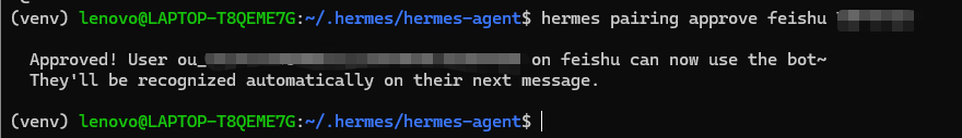 终端界面截图，显示在 Lenovo 笔记本电脑上运行的 hermes-agent 程序，执行 'hermes pairing approve feishu' 命令后返回成功确认信息，提示用户已批准并可使用机器人功能。