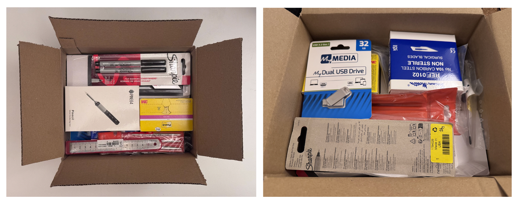 打开的纸箱内杂乱堆放多种文具用品