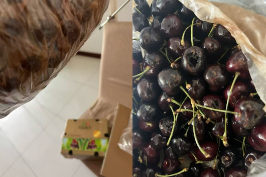 收到的一箱车厘子，装在塑料袋和纸箱中