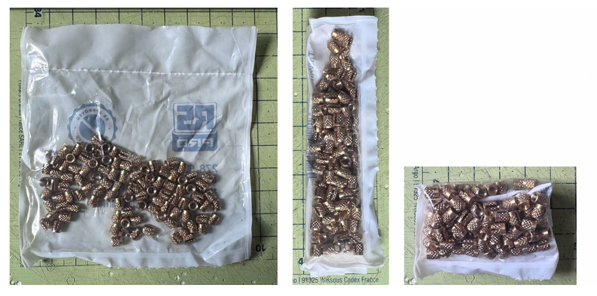 透明塑料袋中装满金色金属螺母