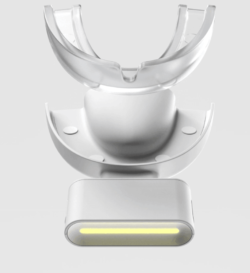 由透明牙托和发光长条组成的美容设备，设计简约