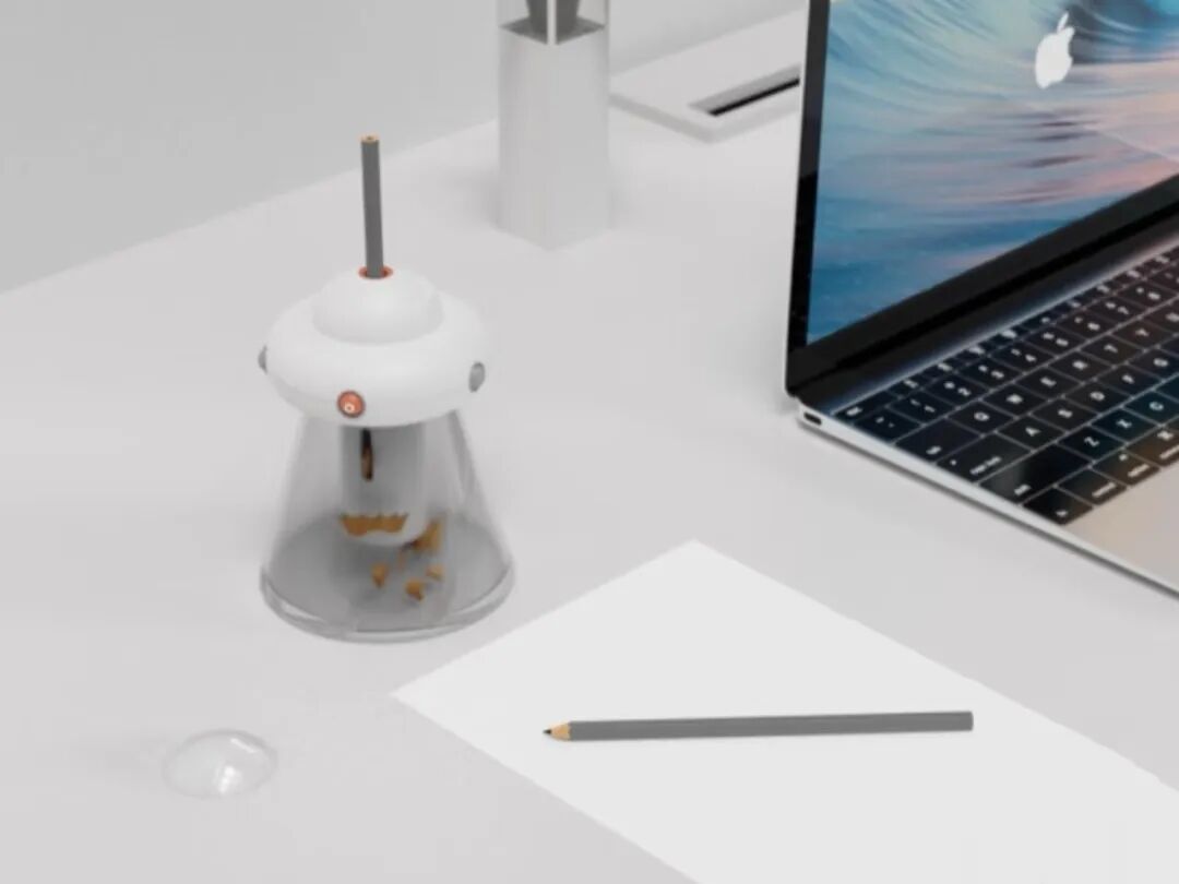 现代简约自动卷笔刀与苹果电脑桌面场景